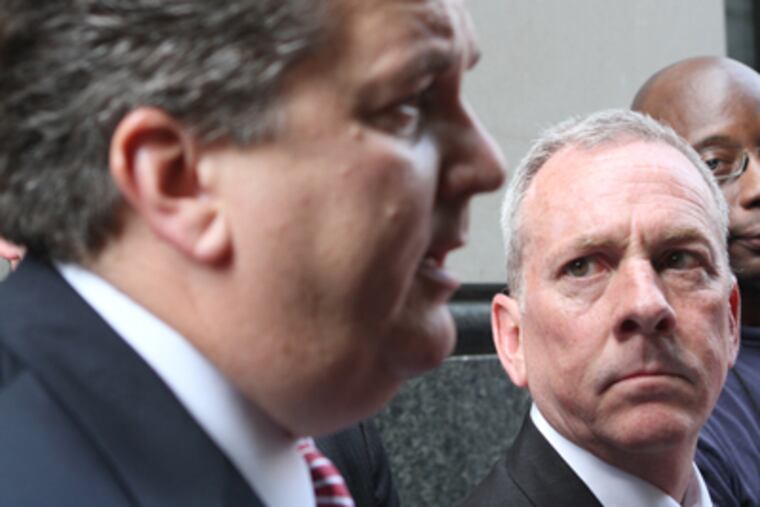 James J. Brennan, right, with his lawyer William Brennan. (Charles Fox/Staff Photographer)