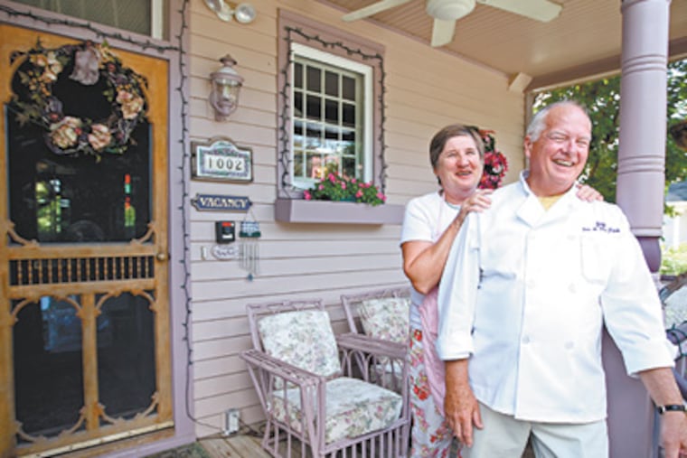 Mary Anne and Jay Gorrick's Victorian in Cape May, which is half-B&B, half-private home. they stand on their front porch. ( Michael Bryant / Staff photographer )