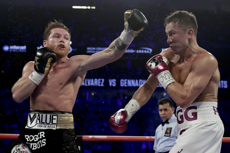 Canelo Alvarez (left) and Gennady Golovkin trade punches in the third round during a middleweight title match in Las Vegas on Saturday.