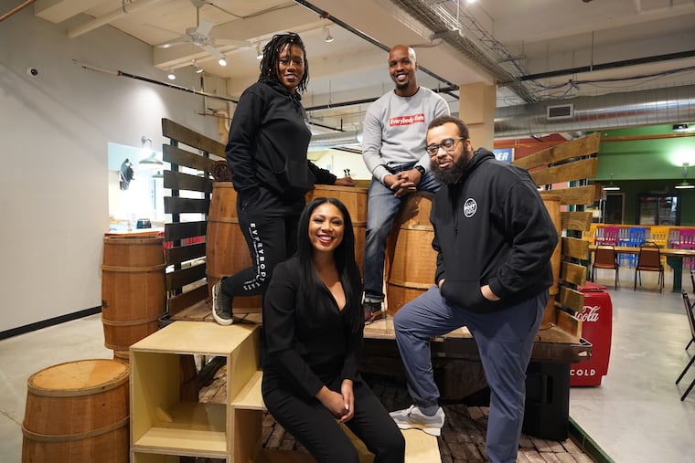 Chefs from Everybody Eats Philly (from left) Aziza Young, Stephanie Willis, Malik Ali, and Kurt Evans on a pickup truck set up in the Vittles Food Hall in Chester, Pa.
