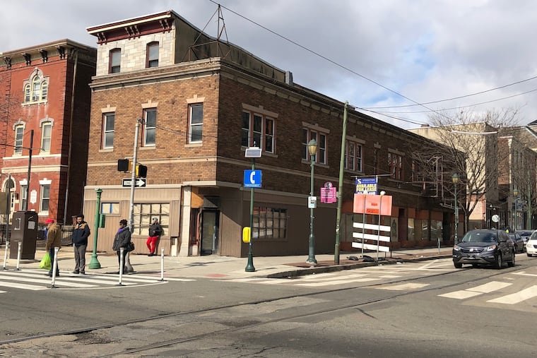 Third floor of 4003 Chestnut St. building can be seen above roofline of 4001 Chestnut St. The two are being redeveloped to include dwelling and visitor units.