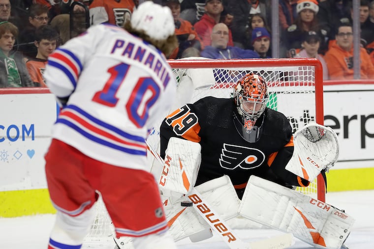 Flyers goaltender Carter Hart stops New York Rangers left winger Artemi Panarin during the second-period Monday at the Wells Fargo Center.
