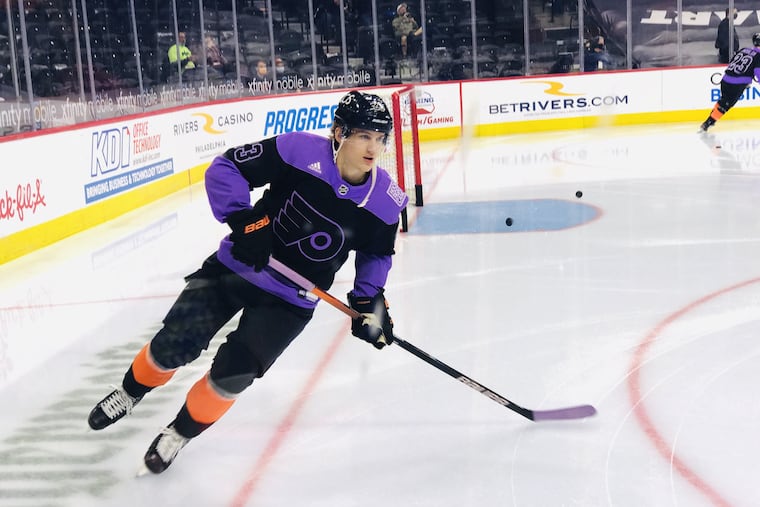 Flyers LW Oskar Lindblom does a solo lap on Hockey Fights Cancer Night Sunday at the Wells Fargo Center
