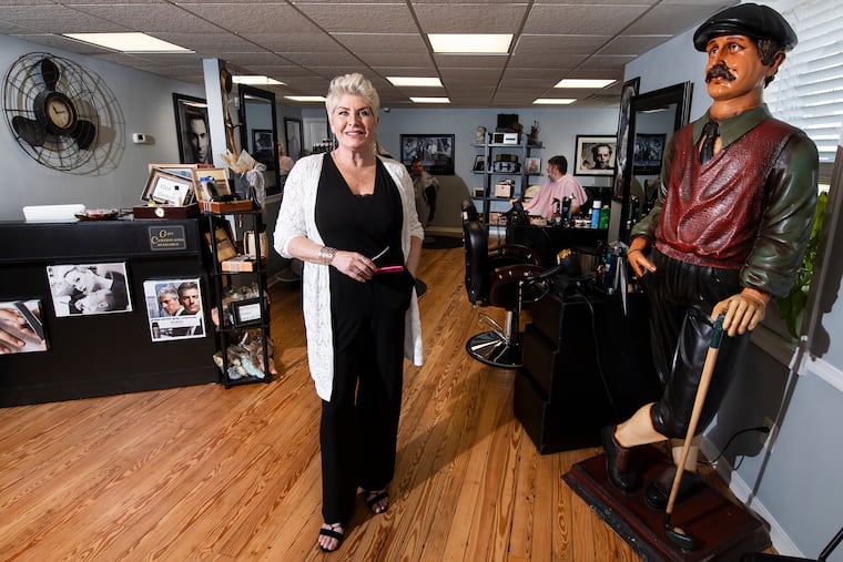 Donna Brosious, barber, inside her Boardroom Barbershop, in the center of Medford, N.J.