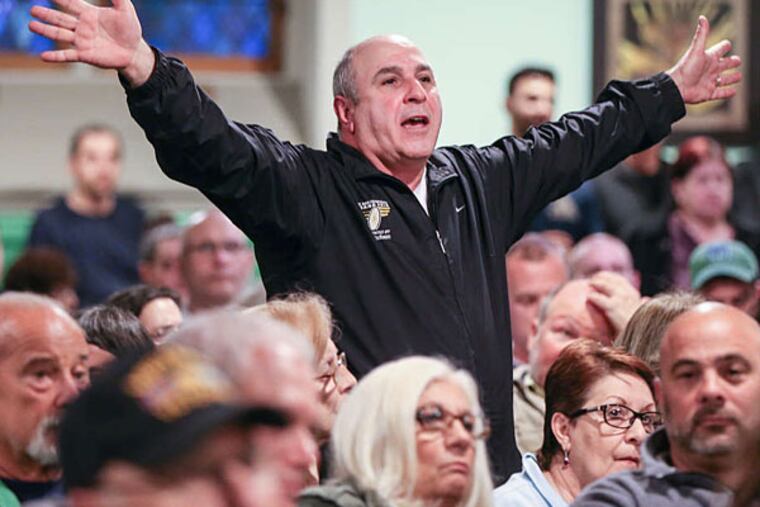 Anthony Massaro is one of the residents who packed the zoning committee meeting about the plan for the site at Ninth and Wharton Streets. Many complained that finding parking will become more difficult. STEVEN M. FALK / Staff Photographer