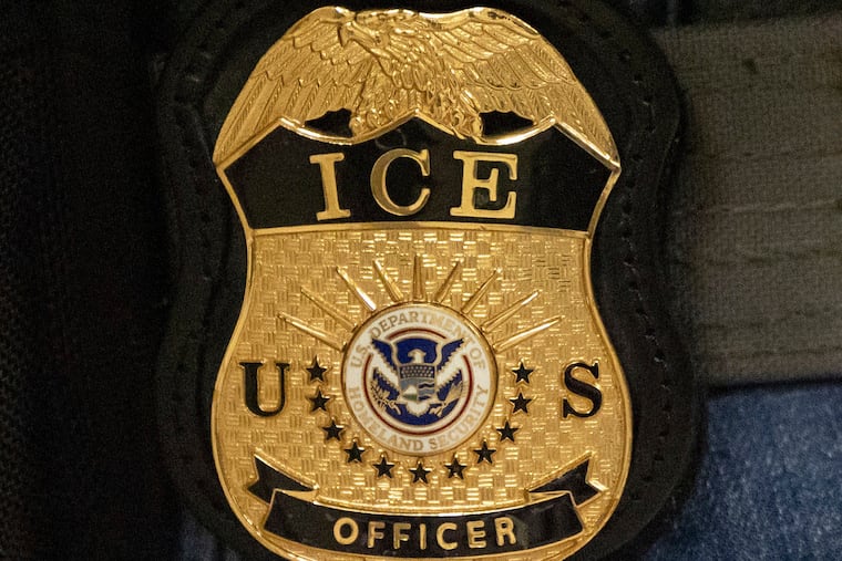 A federal agent wears an Immigration and Customs Enforcement badge in New York, June 10, 2025.