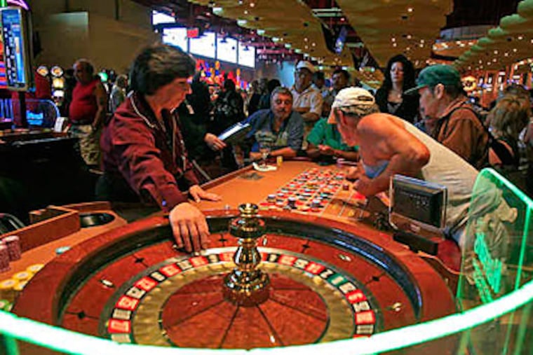 Wheels were spinning at Harrah’s Chester Casino & Racetrack on opening day of table games at the three casinos in the Philadelphia area Sunday. (Akira Suwa / Staff)