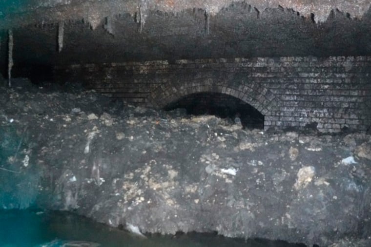 In this photo released Tuesday Jan. 8, 2019, by Britain's South West Water company, showing part of a "fatberg", a mass of hardened fat, oil and baby wipes, measuring some 64 meters (210 feet) long, in the town of Sidmouth, England. The fatberg is blocking a sewer in the southwestern English town, and will take a sewer team around eight weeks to dissect and dispose of the obstruction.