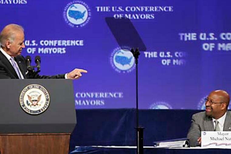 Vice President Joe Biden acknowledges Philadelphia Mayor Michael Nutter before speaking at the Annual Meeting of the U.S. Conference of Mayors, Friday, June 15, 2012, in Orlando, Fla. (AP Photo/John Raoux)
