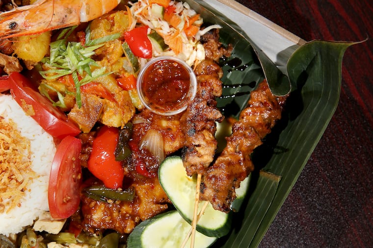 Various items are pictured in the "Not Pizza" box, a version of a rijsttafel meal, at Hardena in South Philadelphia on Thursday, July 16, 2020.