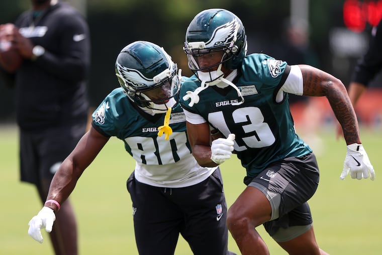 Darius Cooper (left) and Dontayvion Wicks (right) are but two of a long list of names at wide receiver for the Eagles.