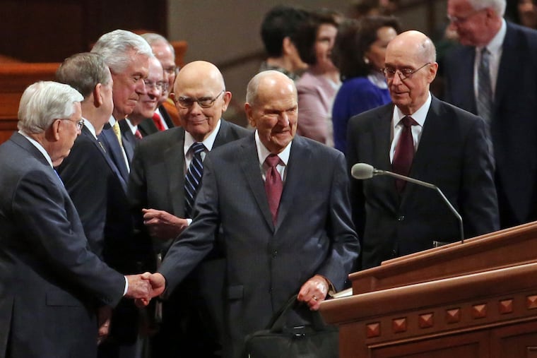 The Church of Jesus Christ of Latter-day Saints President Russell M. Nelson, center, greets the conference of The Church of Jesus Christ of Latter-day Saints Saturday, April 6, 2019, in Salt Lake City. Church members are preparing for more changes as they gather in Utah for a twice-yearly conference to hear from the faith's top leaders.