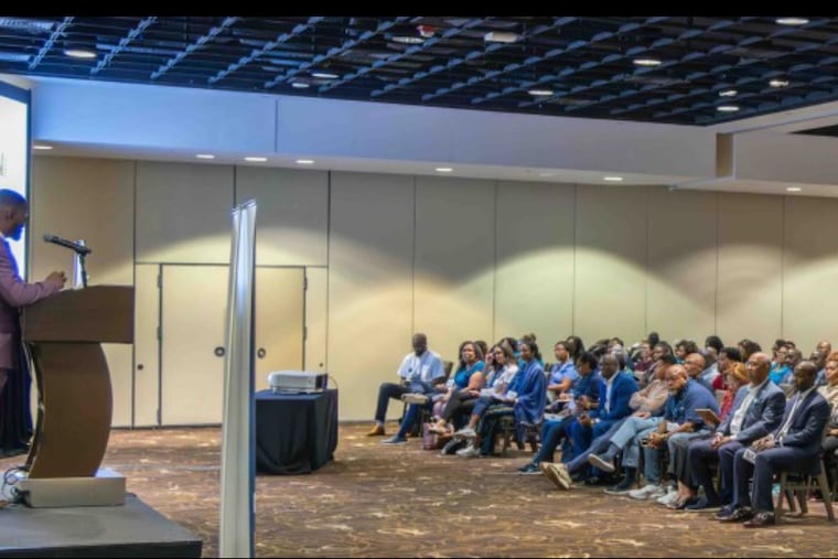 Omari Aarons-Martin addresses a gathering of NAAIA, the National African American Insurance Association, in 2024.