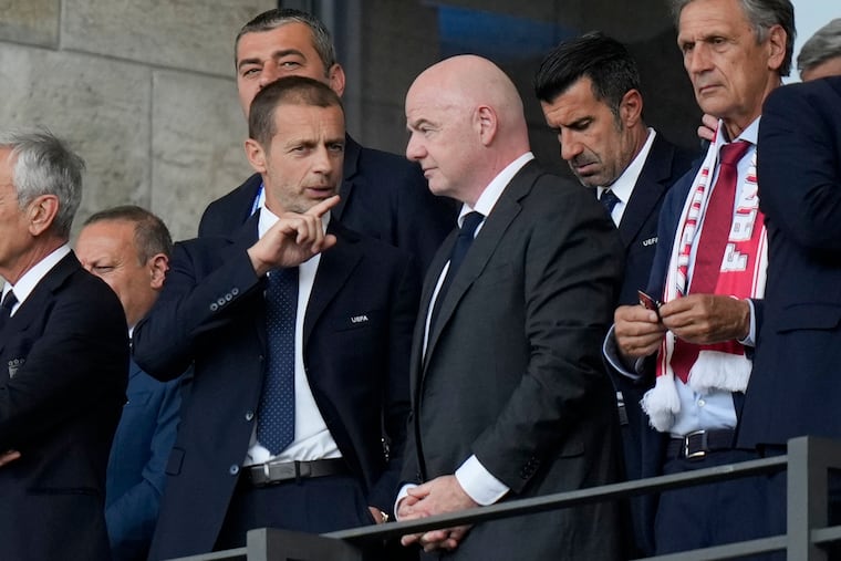 UEFA President Aleksander Čeferin (left) talking with FIFA President Gianni Infantino during a game at the 2024 European Championship.