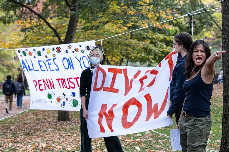 Students with Fossil Free Penn protest on Monday to announce their filing of a divestment complaint with the Office of the Pennsylvania Attorney General against Penn's Board of Trustees.