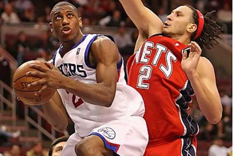 Thaddeus Young goes up for a shot against Nets' Josh Boone during the Sixers' 97-94 win on Friday. (Steven M. Falk / Staff Photographer)