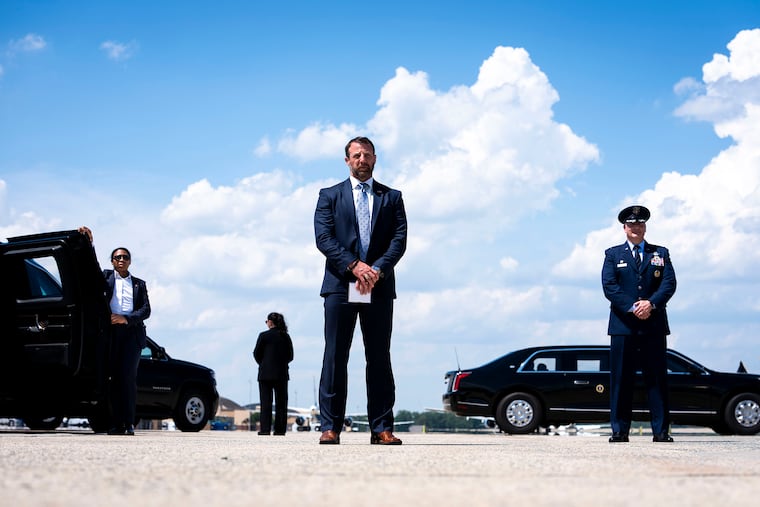 Homeland Security Secretary Markwayne Mullin looks on as President Donald Trump speaks to reporters at Joint Base Andrews, Md., Wednesday, May, 20, 2026. Homeland Security Secretary Markwayne Mullin’s proposal could block hubs like Boston, New York and Los Angeles from accepting international flights.