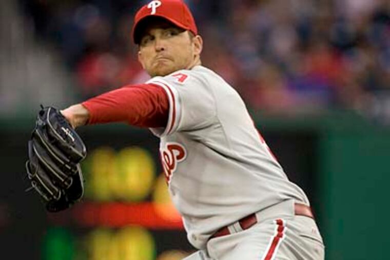 "He's just searching right now for the right way to go about it," Phillies coach Rich Dubee said of Brad Lidge's struggles. (Evan Vucci / AP file photo)