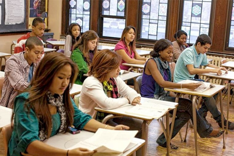 Students are tested in a Columbia High School classroom in Maplewood, N.J. Rutgers University will try to entice New Jersey's best and brightest to stay in-state with a new undergraduate merit scholarship. (AP Photo / The College Board - George Lange)