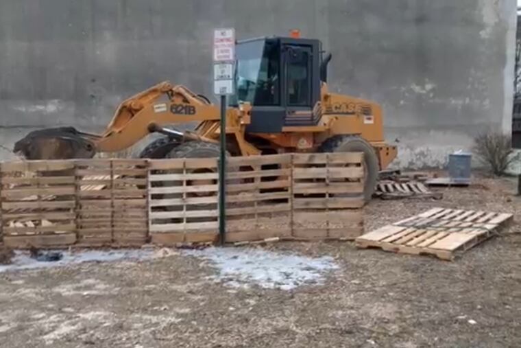 A community volunteer is angry that city officials bulldozed a makeshift fence on a vacant lot turned into a dog park.
