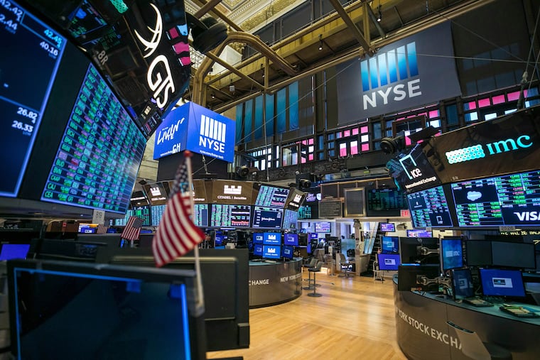 This photo provided by the New York Stock Exchange shows the unoccupied NYSE trading floor, closed temporarily for the first time in 228 years as a result of coronavirus concerns.