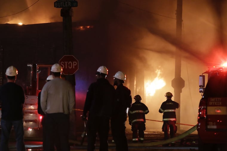 Philadelphia firefighters battling a 4-alarm warehouse fire on East Butler St at Sepviva St in the Port Richmond section of the city on April 7, 2019.