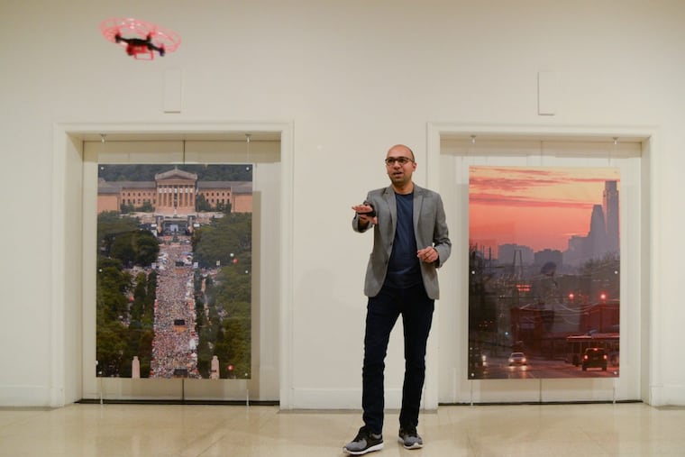 Pramod Abichandani, a longtime professor at Drexel University now at New Jersey Institute of Technology, demonstrates how to use the Aura drone’s gesture-tracking glove controller that he developed.