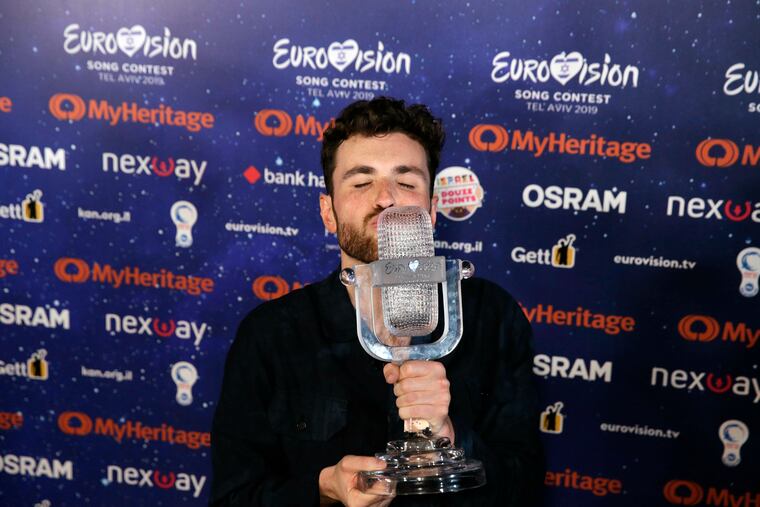 Duncan Laurence of the Netherlands celebrates with the trophy during a press conference after winning the 2019 Eurovision Song Contest grand final with the song "Arcade" in Tel Aviv, Israel, Saturday, May 18, 2019. (AP Photo/Sebastian Scheiner)