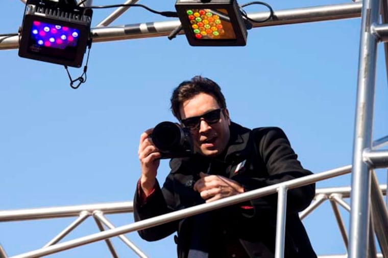 Jimmy Fallon rides a float in the Macy's Thanksgiving Day Parade in New York, Thursday, Nov. 22, 2012. (AP Photo/Charles Sykes)