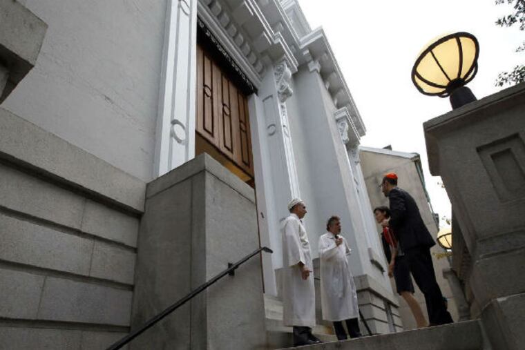 Cantor Bob Freedman (left) and Rabbi Avi Winkokur (center) greet Rosh Hashanah worshipers at Society Hill Synagogue.