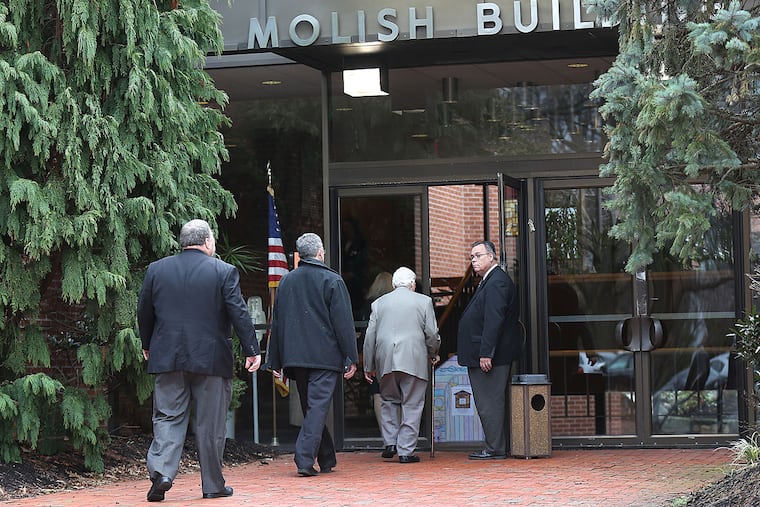Mourners arrive for Harry Gross' funeral service at the Old York Road Temple-Beth Am in Abington.