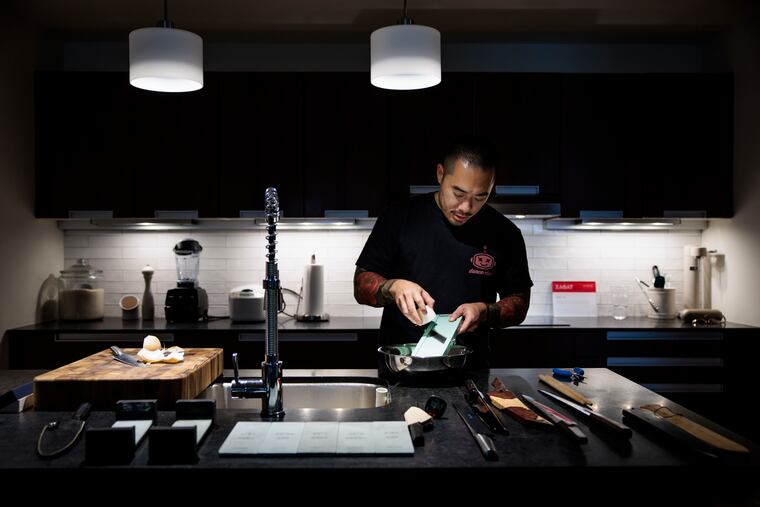 Chef Jesse Ito of Royal Izakaya and dancerobot demonstrates how to use a mandolin at his Center City home kitchen.