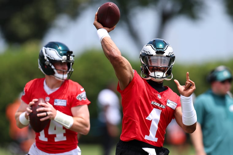 Eagles quarterback Andy Dalton (left) was brought in to compete for a role behind Jalen Hurts. Will he emerge as QB2 during training camp and preseason?