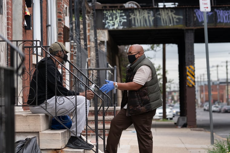 Jackie, left, talks with Troy Mouzon, recovery specialist with Pathways to Recovery.