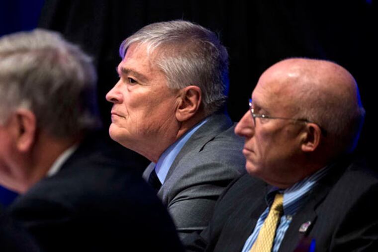 Eric Barron (center), president of Pennsylvania State University, where 18 percent of the board of trustees members are women. (MATT ROURKE / AP)