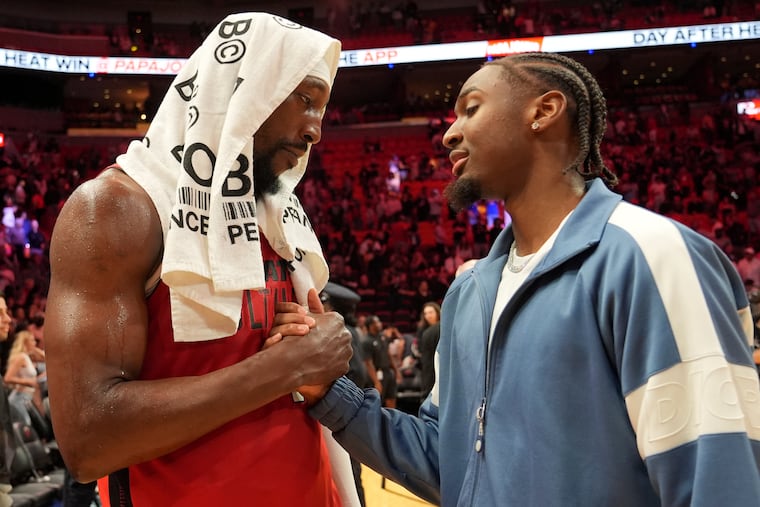 Heat center Bam Adebayo (left) shakes hands with injured Sixers guard Tyrese Maxey after the game Monday in Miami. Maxey has been out the past six games with a hamstring injury.
