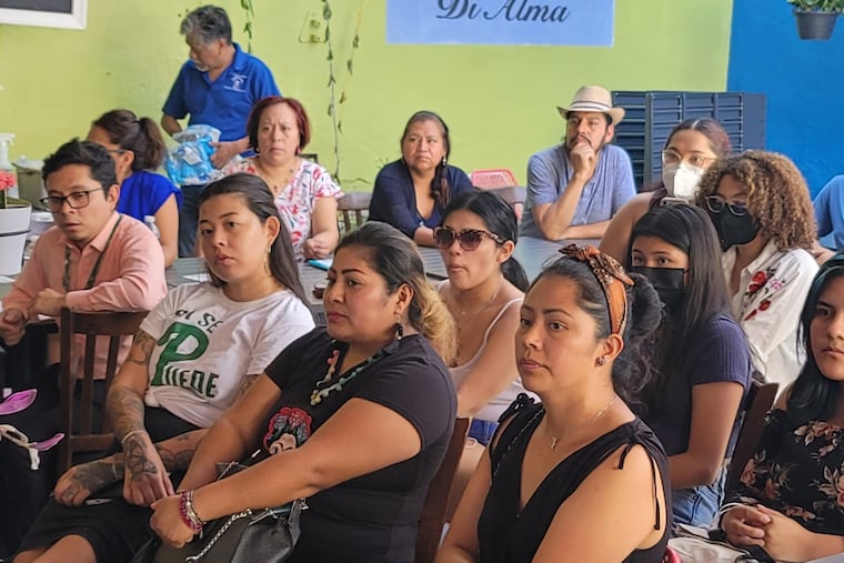 Members of the Philadelphia Mexican Business Association and the South Philly immigrant advocacy group Juntos listen to police and public officials on Wednesday at Alma del Mar restaurant on South Ninth Street.