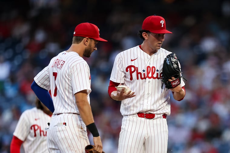Phillies pitcher Andrew Painter (right) exited the game after four innings due to hamstring tightness on Wednesday.