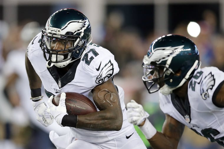Malcolm Jenkins' fraternity brand is in full display in this photograph of his interception return against Tom Brady. (Yong Kim / Staff Photographer)