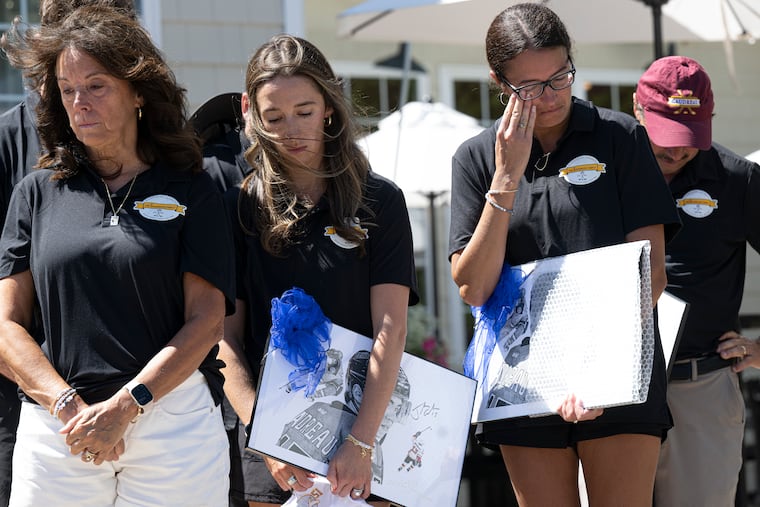 Jane Gaudreau (left), Katie Gaudreau, Kristen Venello, and Guy Gaudreau share a moment after receiving plaques honoring Johnny and Matthew Gaudreau during the inaugural Gaudreau Family Scholarship Golf Outing on Friday at Ron Jaworski's Running Deer Golf Club in Pittsgrove, N.J.
