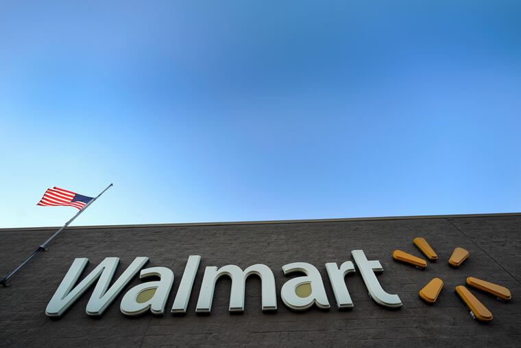 FILE- This Nov. 9, 2018, file photo shows a Walmart Supercenter in Houston. Walmart agreed Thursday, June 20, 2019, to pay $282 million to settle civil and criminal allegations of overseas corruption, including payment through a Brazilian subsidiary of more than $500,000 to an intermediary known as a "sorceress" for her uncanny ability to make permit problems disappear. (AP Photo/David J. Phillip, File)