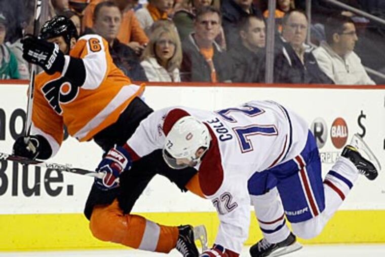 Andreas Lilja won't return until late October or early November at the earliest, according to Paul Holmgren. (Matt Slocum/AP file photo)