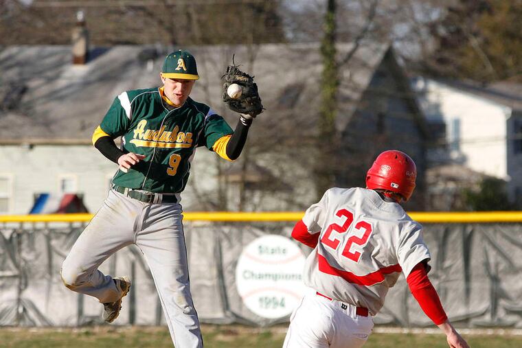 Haddon Township's Casey Boyle slides into second base underneath Audubon's Drew DiPrinzio in the Green Wave's 7-6 victory. MICHAEL S. WIRTZ /Staff Photographer
