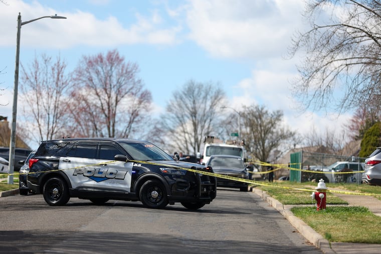 Law enforcement on Viewpoint Lane investigate the scene of a shooting in Falls Township Saturday.