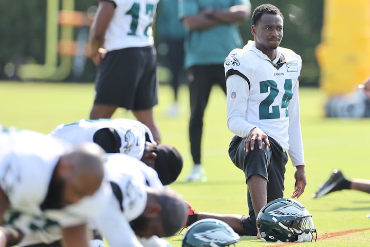 Eagles safety Drew Mukuba stretches during the training camp session Sunday at the NovaCare Complex.