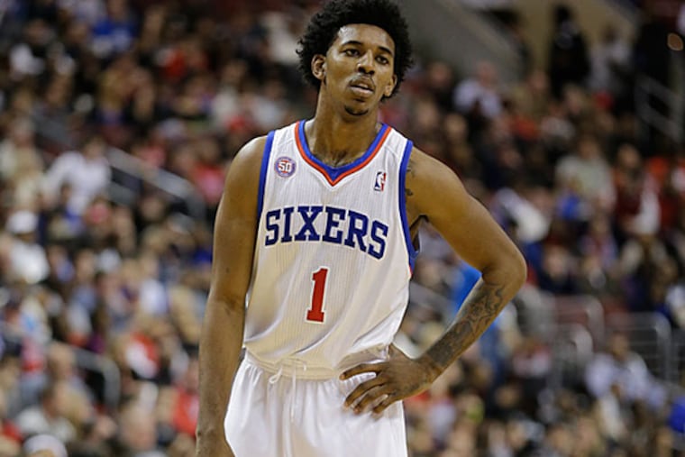 Philadelphia 76ers' Nick Young watches during an NBA basketball game against the Oklahoma City Thunder, Saturday, Nov. 24, 2012, in Philadelphia. Oklahoma won 116-109. (AP Photo/Matt Slocum)