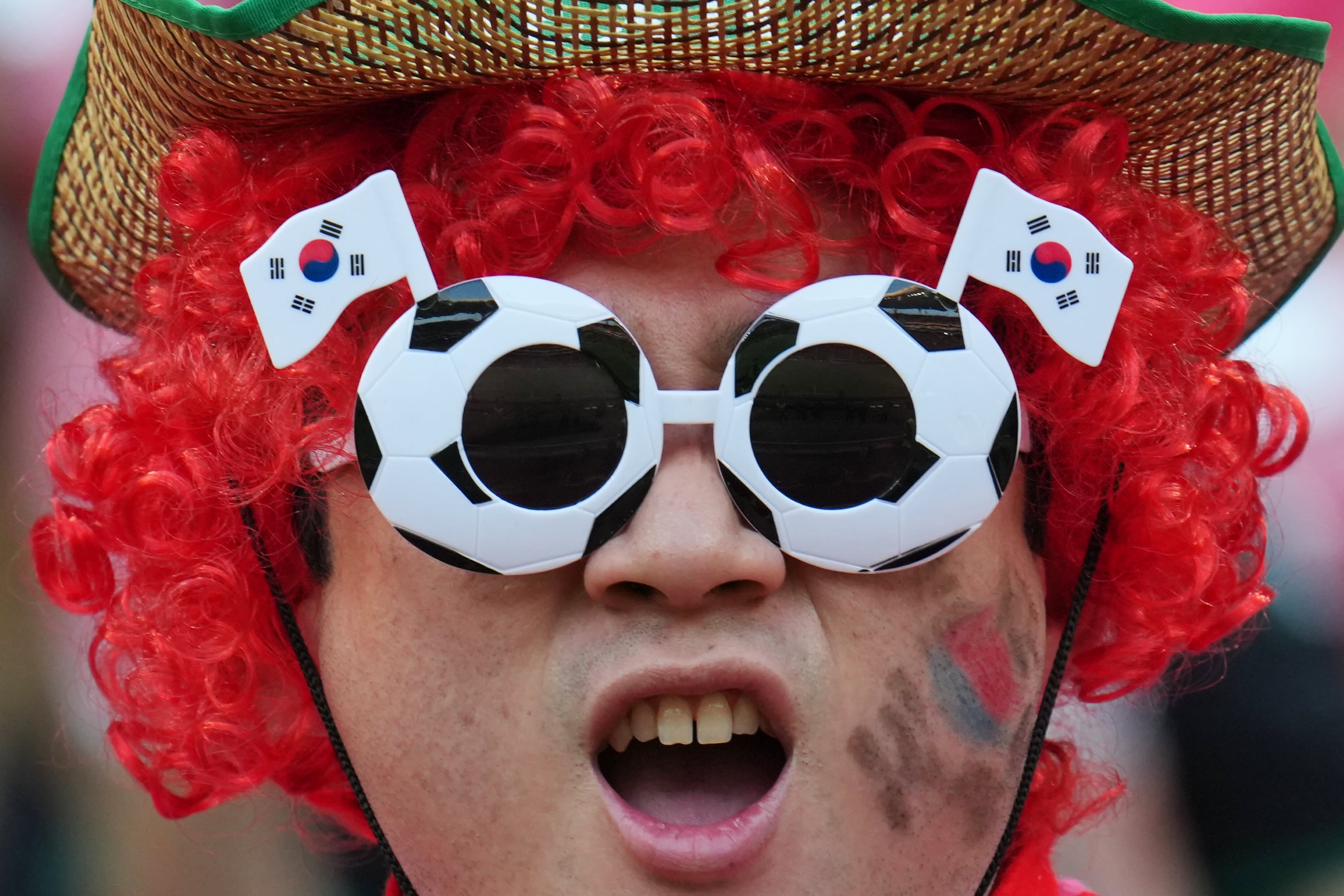 World Cup fans flood stadiums and fan zones with dazzling costumes, facepaint and flags — in photos