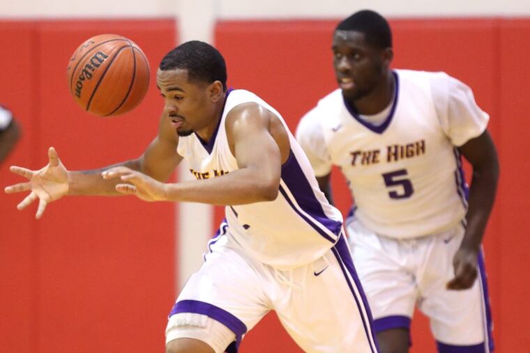 Corey Greer, left, of Camden loses control of the ball after coming up with a loose ball against Camden Catholic in the 1st quater at Rutgers University’s Camden campus on Jan 9, 2018. CHARLES FOX / Staff Photographer