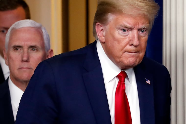 President Donald Trump and Vice President Mike Pence arrive to speak about the coronavirus in the James Brady Press Briefing Room of the White House.