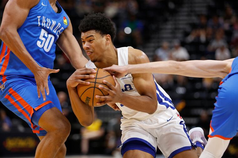 Sixers guard Jaden Springer, center, drives against the Oklahoma City Thunder during an NBA summer league basketball game Thursday.